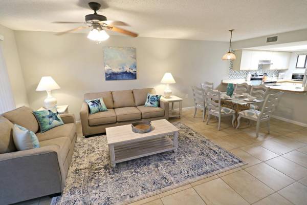 view of living room and kitchen area at ocean village club rental unit in st augustine florida